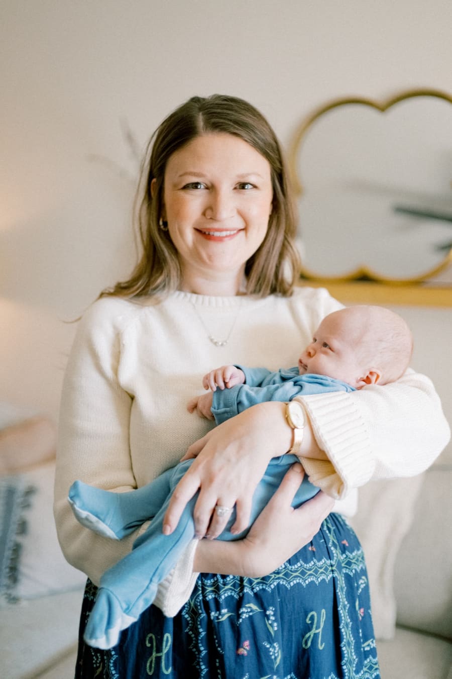 Kenzie Scott holding a newborn baby
